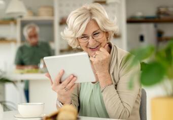 woman enjoying email on tablet